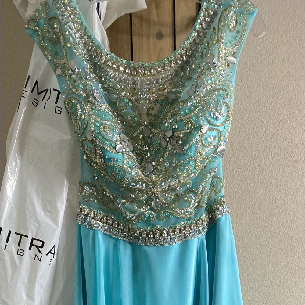 Formal Beaded dress, color teal, size 4. No missing beads or snags.